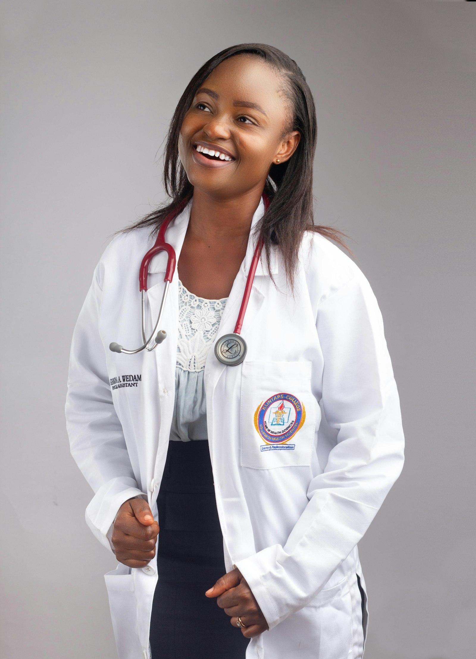 A South African healthcare worker in a white coat with a stethoscope.